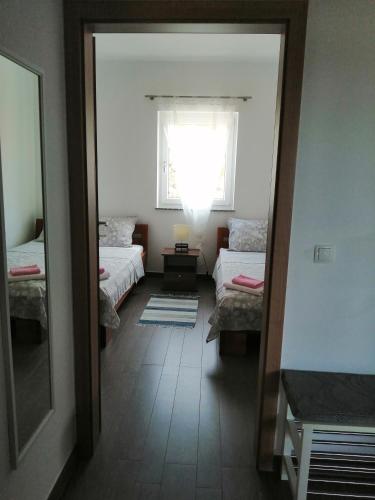 Postel nebo postele na pokoji v ubytování Villa Luce Apartment House