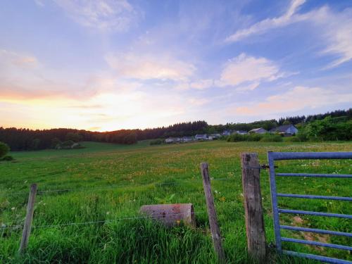 a fence in the middle of a field at Ferienwohnung Schwalbennest in Weinsheim