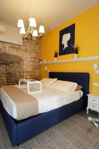 Ένα ή περισσότερα κρεβάτια σε δωμάτιο στο Cecenero Rooms