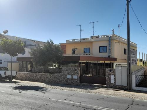 a building on the side of a street at Flor de Sal in Vila Real de Santo António
