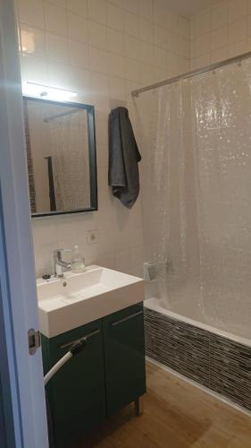a bathroom with a sink and a shower at Foz Playas in Foz