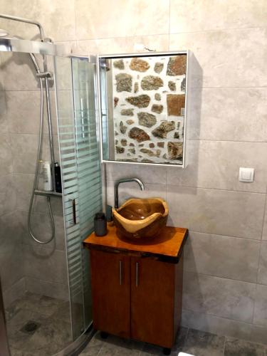 a bathroom with a sink and a shower at Oikia Stone House in seaside Kalo Chorio in Agios Nikolaos