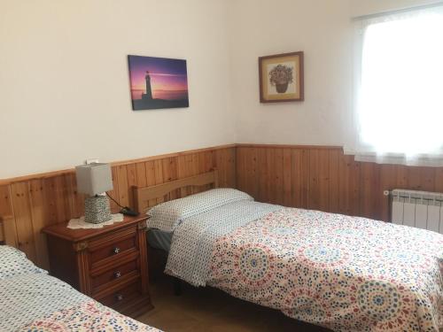 Letto o letti in una camera di Pensión El Pozo
