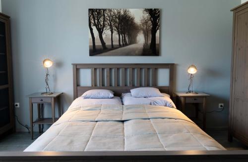 Кровать или кровати в номере Kunfoglalás Apartmanház