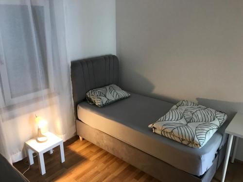 Ένα ή περισσότερα κρεβάτια σε δωμάτιο στο Heidenheimer Zimmer