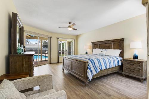 a bedroom with a bed and a living room at Vacation Station in Bradenton