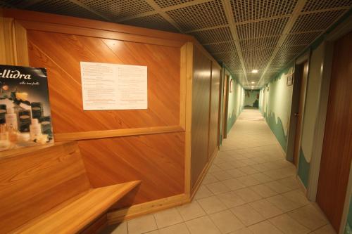 a corridor of a hallway with wooden walls and a corridorngthngthngth at Residenza Del Sole in Gressoney-Saint-Jean