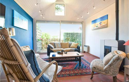 a living room with a couch and a fireplace at Lovely Home In Luneray With Wifi in Luneray