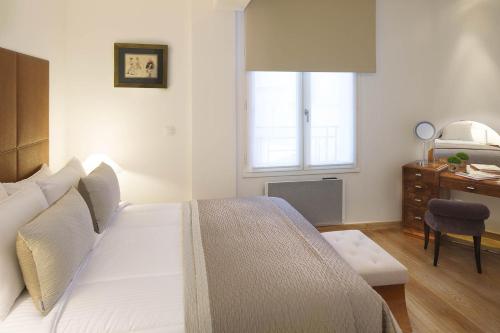 Ένα ή περισσότερα κρεβάτια σε δωμάτιο στο Montmartre Residence