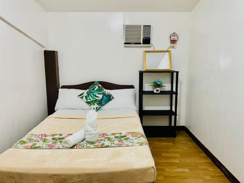 Łóżko lub łóżka w pokoju w obiekcie Amancio's Balai - Near the Airport, City Center!