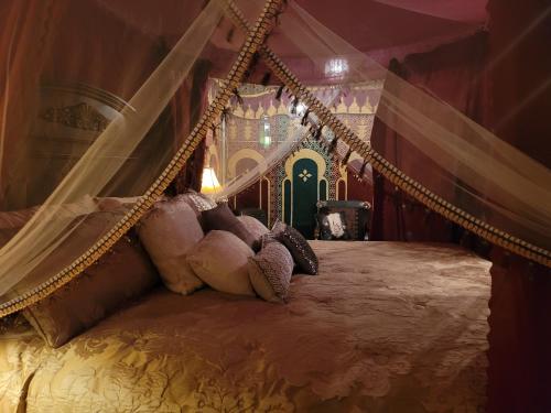 a teddy bear laying on a swing in a bedroom at MAGICAL MOROCCAN TENT WITH POOL CLOSE TO THE BEACH in Fort Pierce