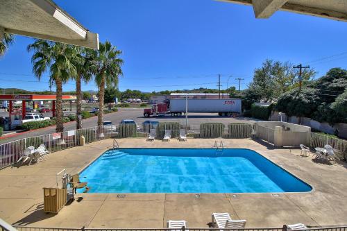 a swimming pool with chairs and a fire truck at Motel 6-Nogales, AZ - Mariposa Road in Nogales