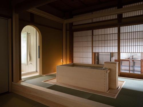 an empty room with a large window in a building at Nazuna Kyoto Nijo-jo in Kyoto