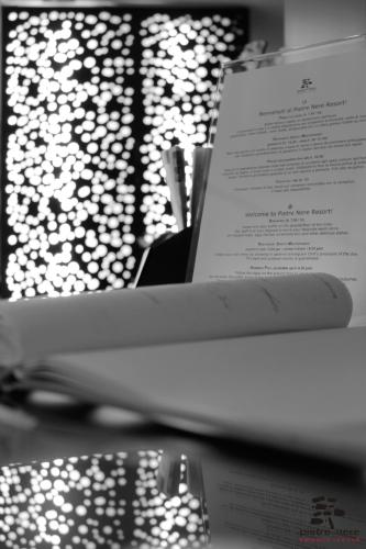 a book sitting on top of a table with a menu at Pietre Nere Resort & Spa in Modica