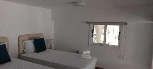 Ένα ή περισσότερα κρεβάτια σε δωμάτιο στο ELEANTRE Holiday apartments
