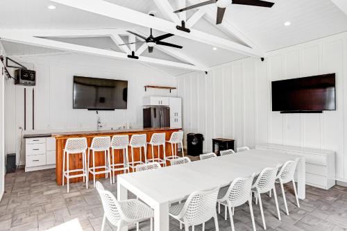 a dining room with a white table and chairs at Rehoboth Beach --- 37484 Washington Street in Rehoboth Beach