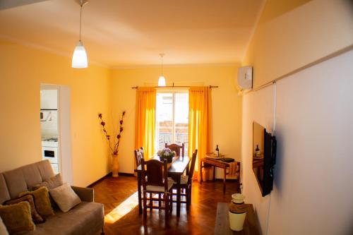 a living room with a couch and a table at Piazza Mendoza in Mendoza