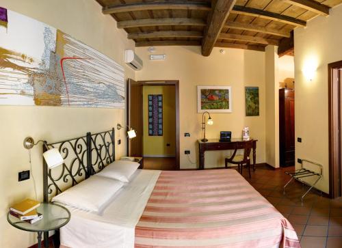 Postel nebo postele na pokoji v ubytování Hotel De Prati