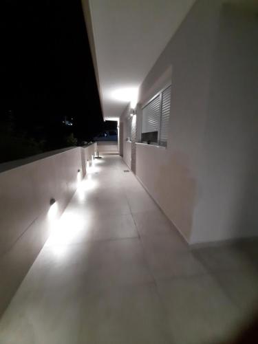 a hallway with lights on the side of a building at Stbs Luxury, Nea Fokea in Nea Fokea