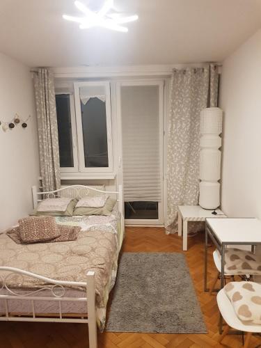 Posteľ alebo postele v izbe v ubytovaní Apartament Plac Trzech Krzyży