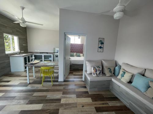 a living room with a couch and a table at Apartamentos La Torre in Río San Juan