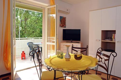 TV a/nebo společenská místnost v ubytování Appartamento Parco Tarragona