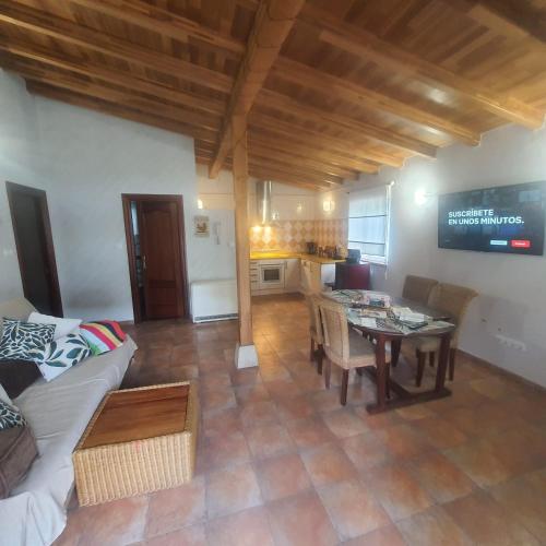 a living room with a couch and a table at C02A01 Acogedora casa vacacional in Los Corrales de Buelna