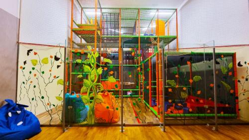 a room with a play room with a play gym at Silvanus Hotel in Visegrád