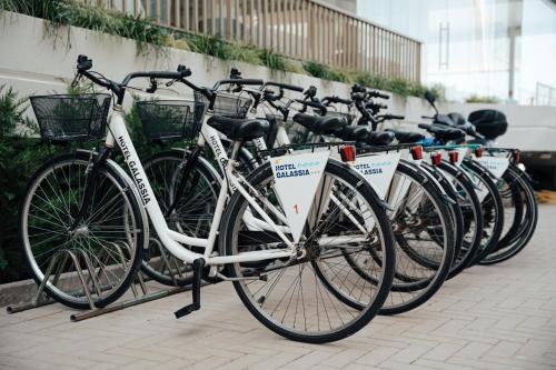 a row of bikes parked next to each other at Hotel Galassia Suites & Spa in Lido di Jesolo