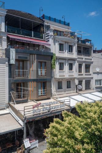 a large white building with balconies on the side of it at Valdivia Hotel Sultanahmet in Istanbul
