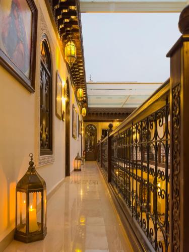 a hallway in a building with a lantern on the floor at Perlekech Riad & Spa in Marrakech
