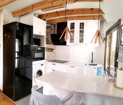 Kuchyň nebo kuchyňský kout v ubytování Ático dúplex con vistas