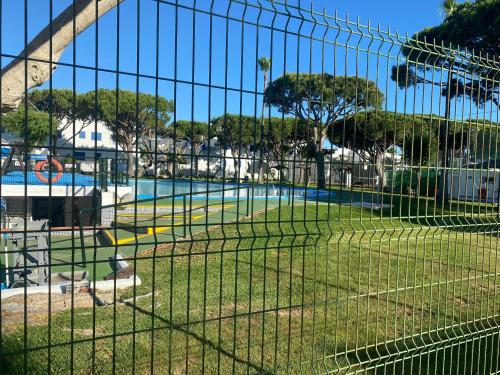 a batting cage at a park with a pool at Apartamento la almadraba in Chiclana de la Frontera