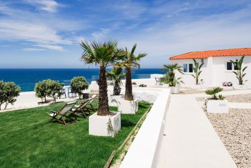 a villa with a view of the ocean at OUTPOST - Ocean Casitas in Azenhas do Mar