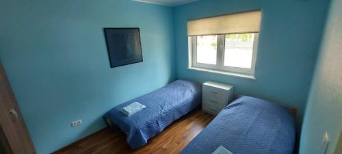 Кровать или кровати в номере Norges puhkemaja
