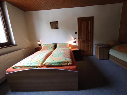Postel nebo postele na pokoji v ubytování Apartmány Vranov