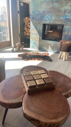 a table with a keyboard on it in a room with a fireplace at Horská Chata Ostružiny in Donovaly