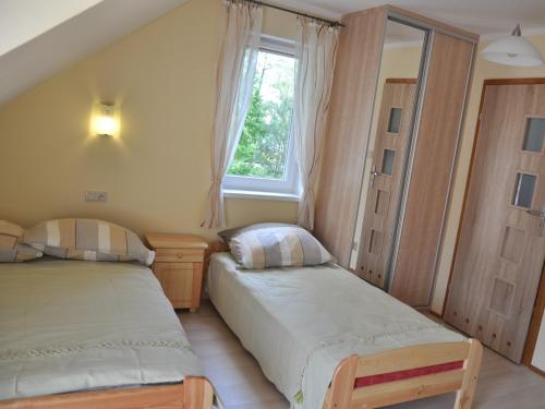 Postel nebo postele na pokoji v ubytování Willa pod Brzozami