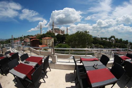 a group of tables and chairs on a roof at Ares Hotel in Istanbul