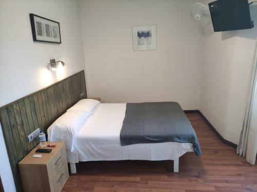 Ένα ή περισσότερα κρεβάτια σε δωμάτιο στο Hostal Cruce