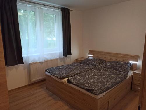 Postel nebo postele na pokoji v ubytování Prázdninový dům Adrelot 33