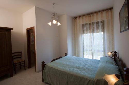 Ένα ή περισσότερα κρεβάτια σε δωμάτιο στο Casa Vacanze Papà Giuseppe