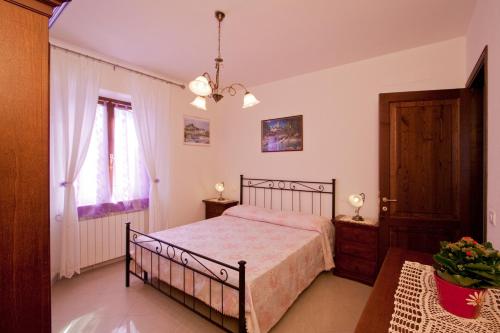 Ένα ή περισσότερα κρεβάτια σε δωμάτιο στο Casa Vacanze Papà Giuseppe
