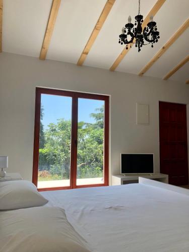 a bedroom with a large bed and a window at Villa Marija in Vrsar