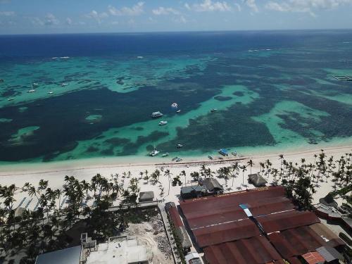 an aerial view of a beach and the ocean at RELAX @ BAVARO BEACH, BIBIJAGUA in Punta Cana