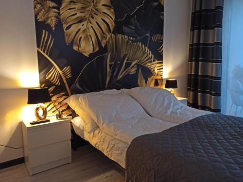 Posteľ alebo postele v izbe v ubytovaní Apartament Czarna Perła