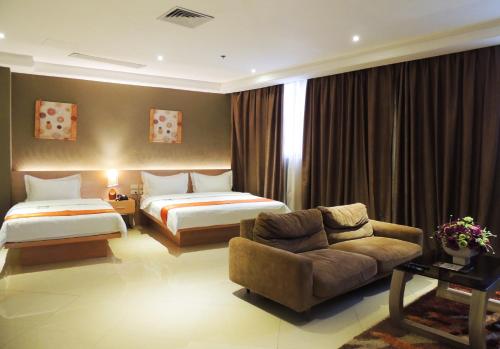 Postel nebo postele na pokoji v ubytování Dela Chambre Hotel