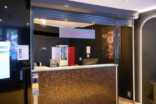 a store window with a sign that reads olympia at Sonata City Hotel in Cologne