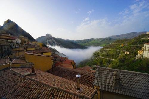 a view of a town with mountains in the background at Al Cuore del Borgo in Castelmezzano