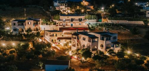 una vista aérea de un pueblo por la noche en Theofilos Appartements, en Livadi